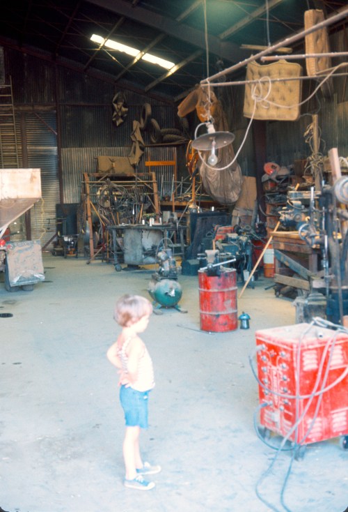 1973 Jul On the farm in the Shop Scott and the equipment